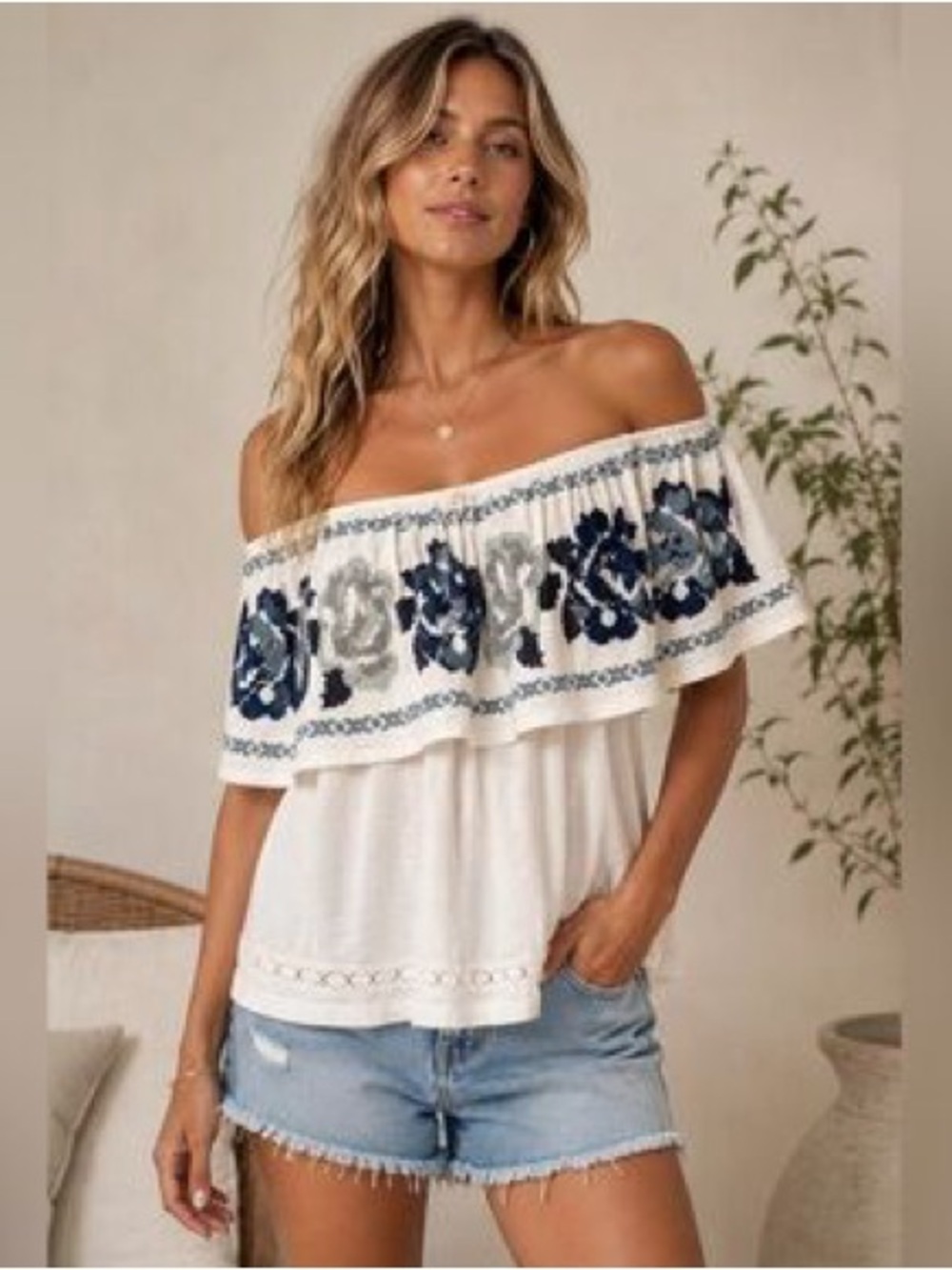 Free People "To the Left" off-the-shoulder top featuring dark floral embroidery